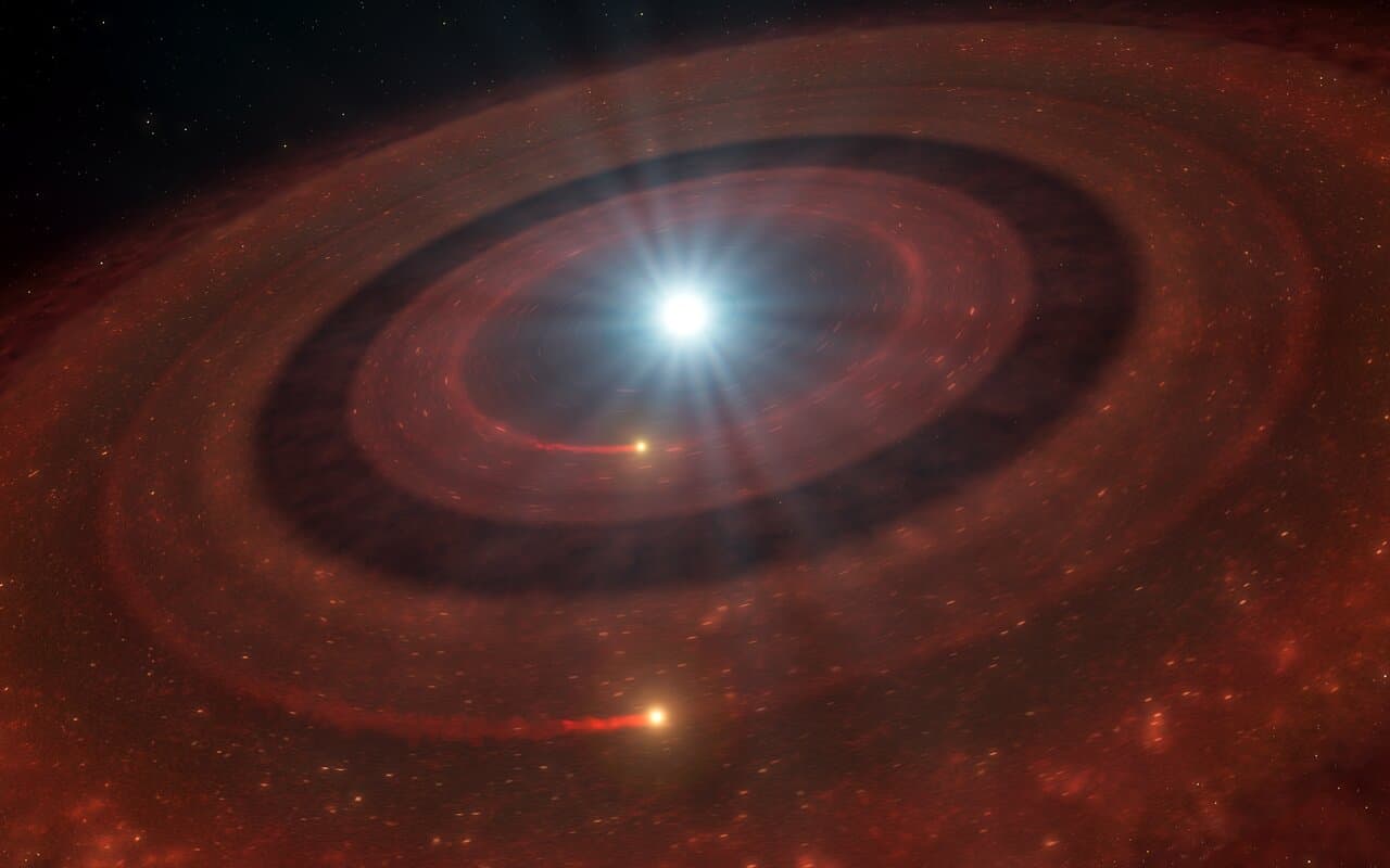 An illustration of a white dwarf surrounded by two concentric debris disks separated by a gap, with luminous trails of gas running through them